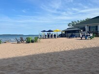 Photo just outside our hotel room including the beach, the outdoor pizza oven, and outdoor bar.