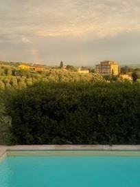 Your view from the pool/front of the house. This is also your view from the dining room and living room, and two of the upstairs beds/one of the baths. All windows in the house open and have screens- views are stunning from all.