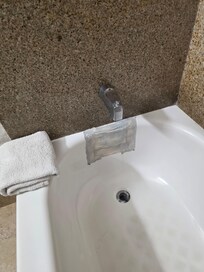 Some kind of patch in the bathtub also the spicket was very loose and there was a gap the shower head was rusty and nasty looking