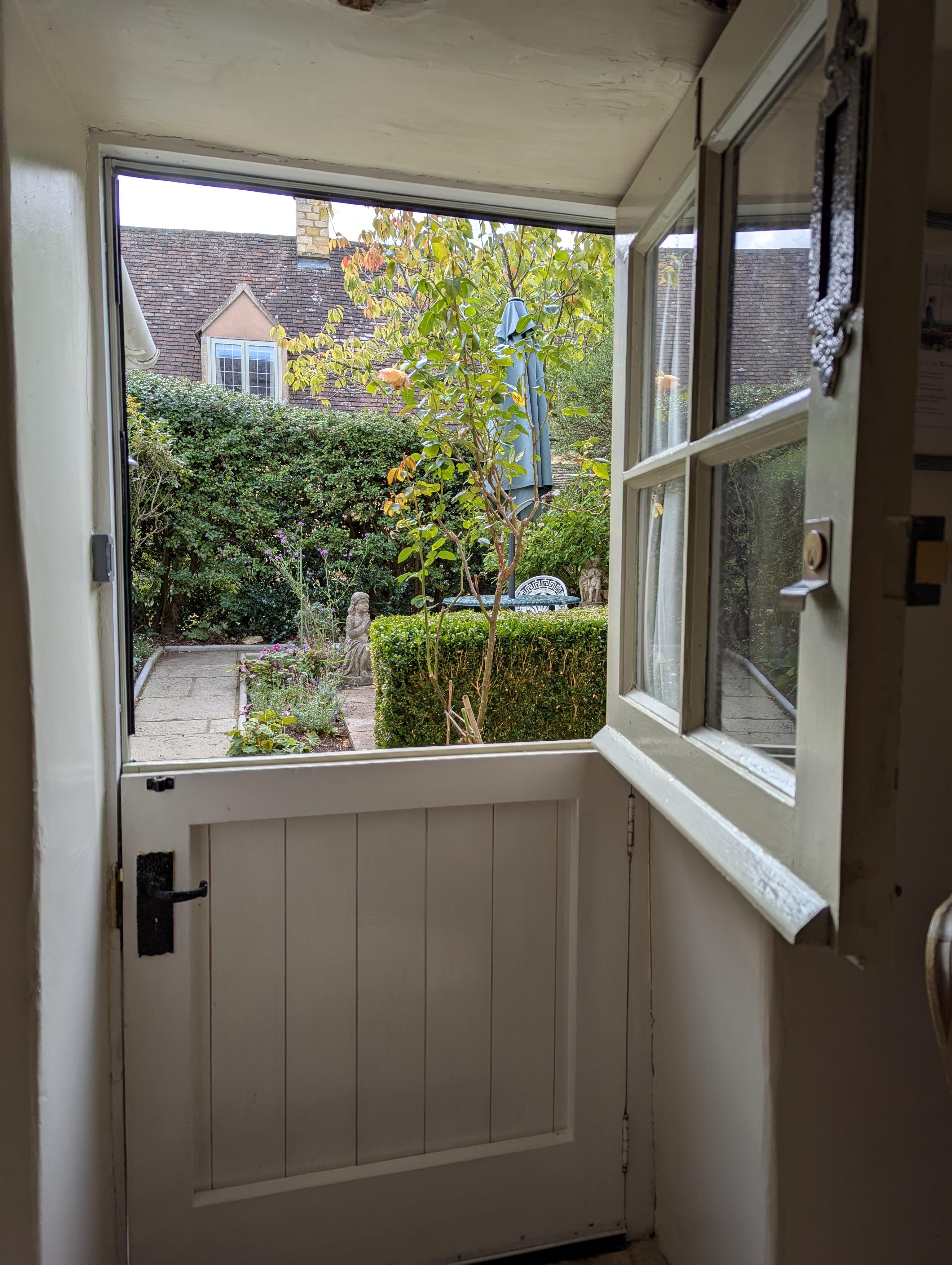 Quaint front door looking out on the courtyard/garden