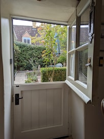 Quaint front door looking out on the courtyard/garden