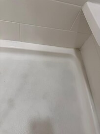 shower area needs deep cleaning to remove dirt and rust
