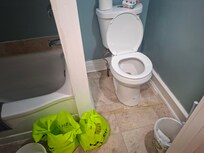 Jugs in bags to use to flush feces