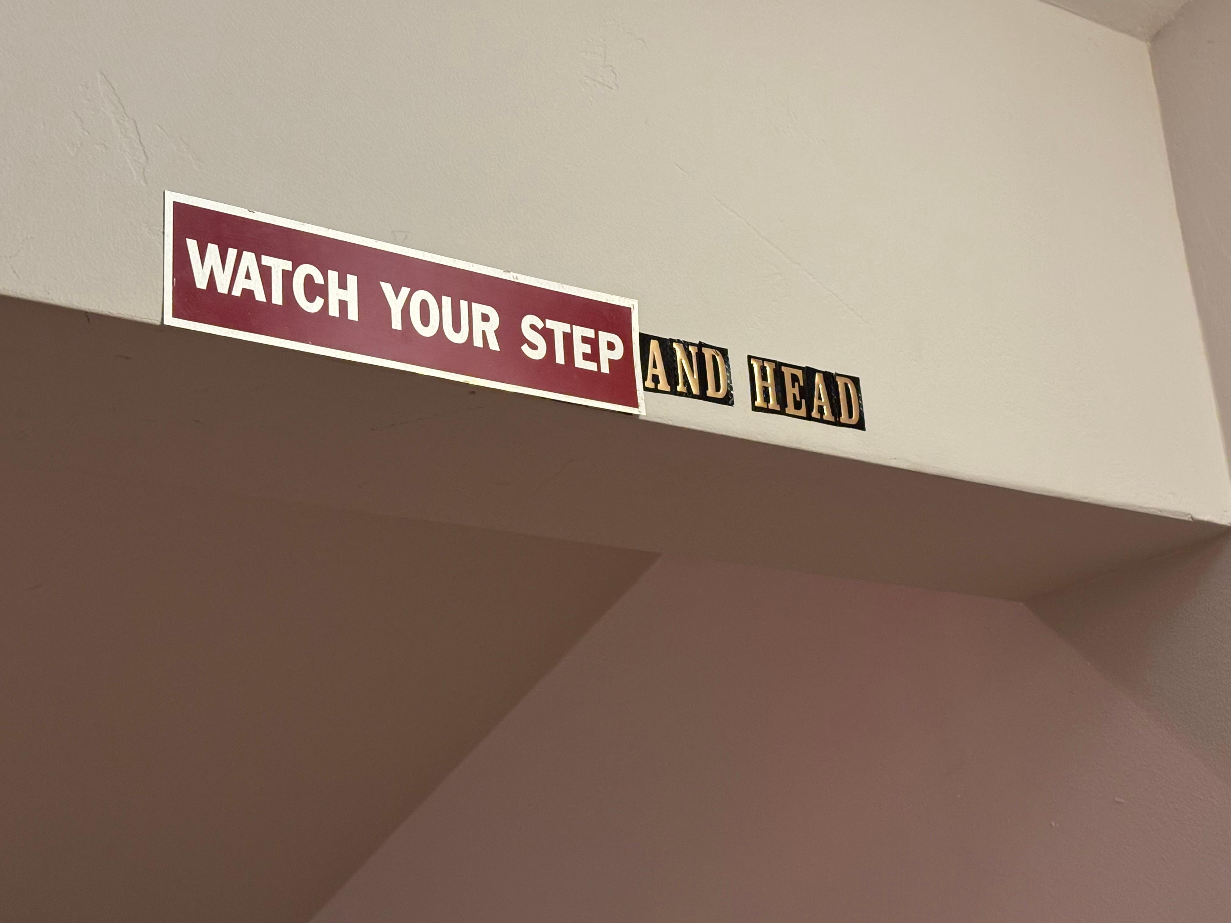 “Warning sign” for fall and overhead hazard