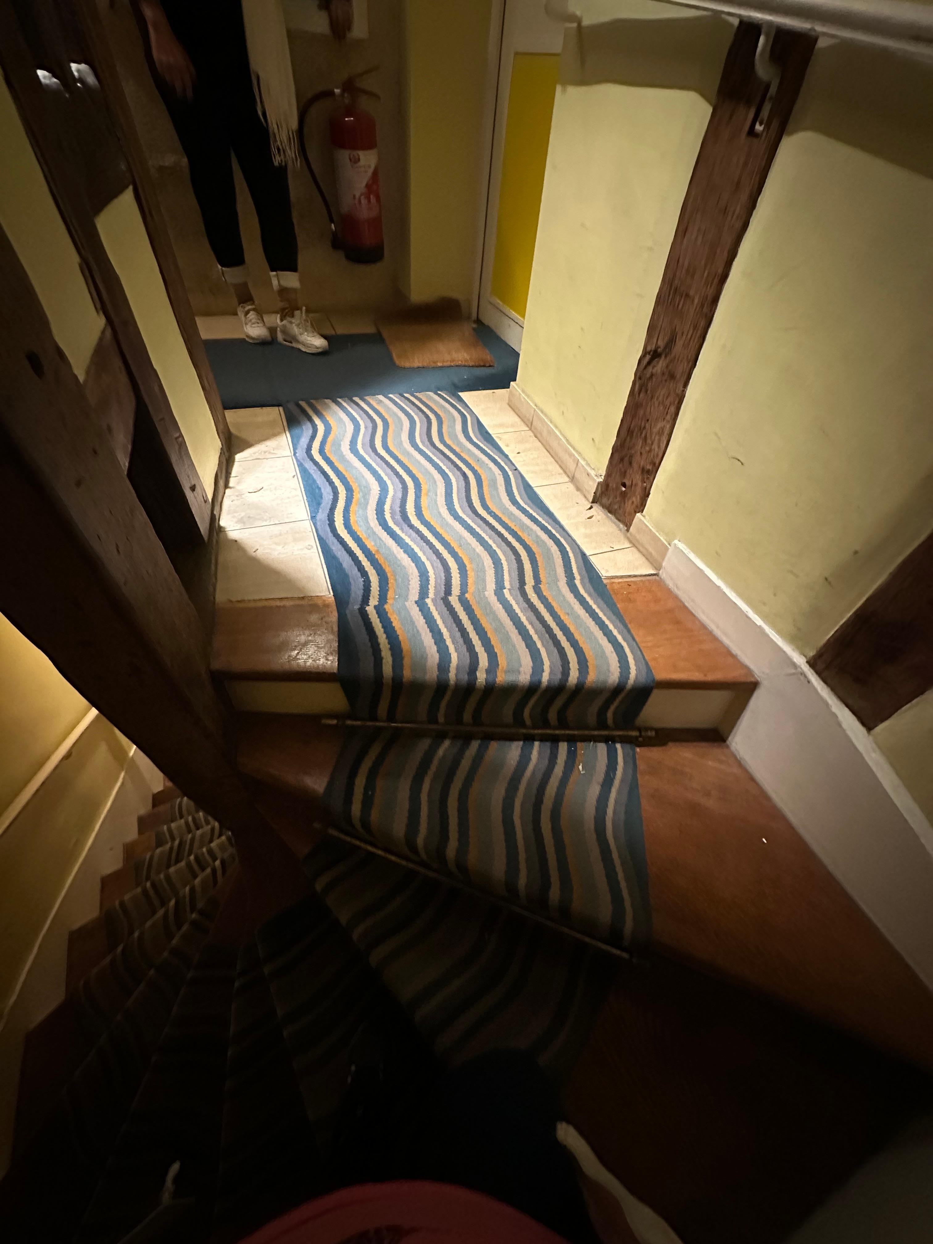 Dirty carpet in dark hallway