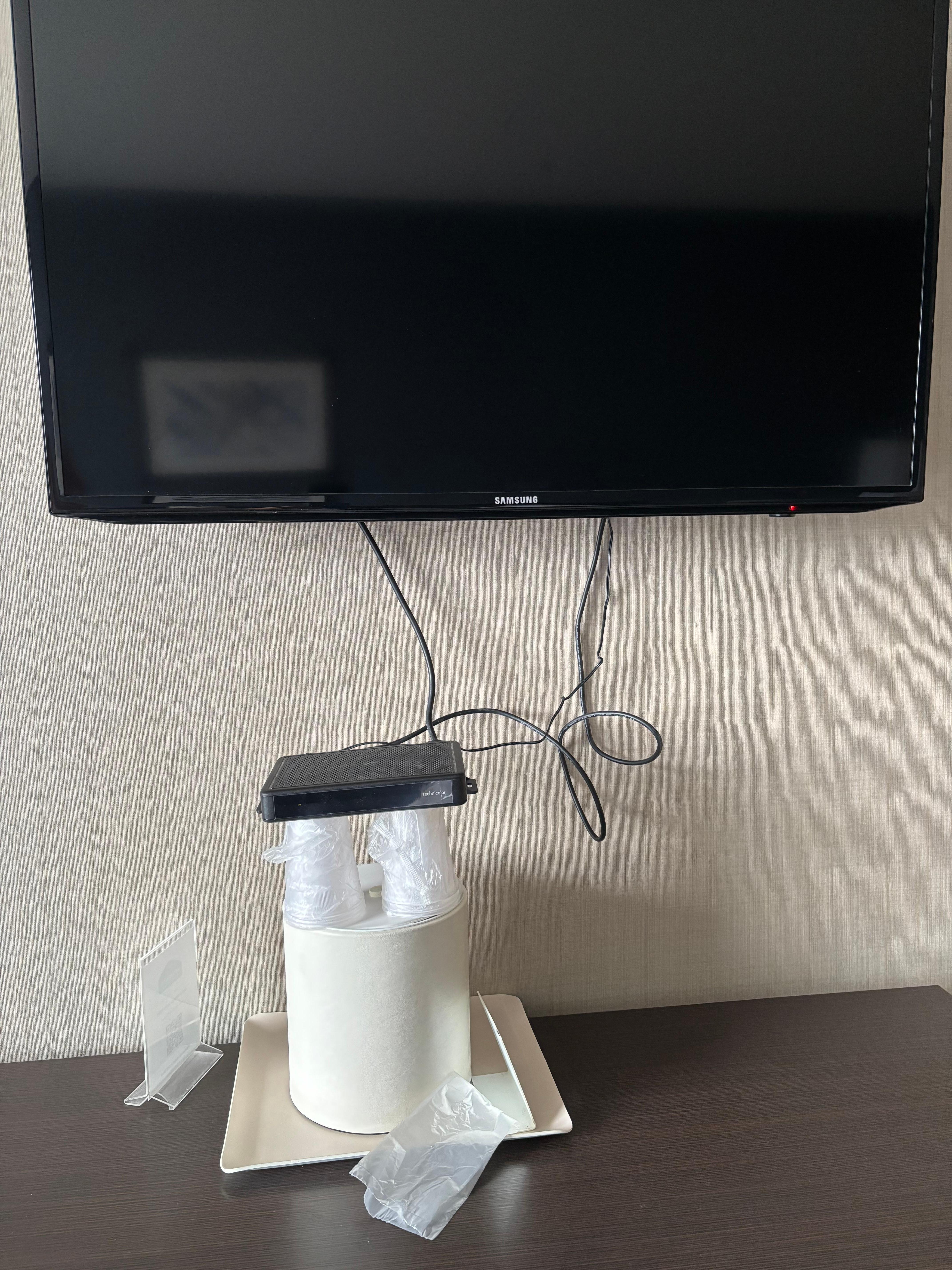 The cable box had to be propped up in order to be able to change channels, otherwise it dangled and the remote couldn’t reach the sensor