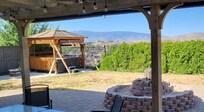 Backyard. Spa gazebo in rough shape.