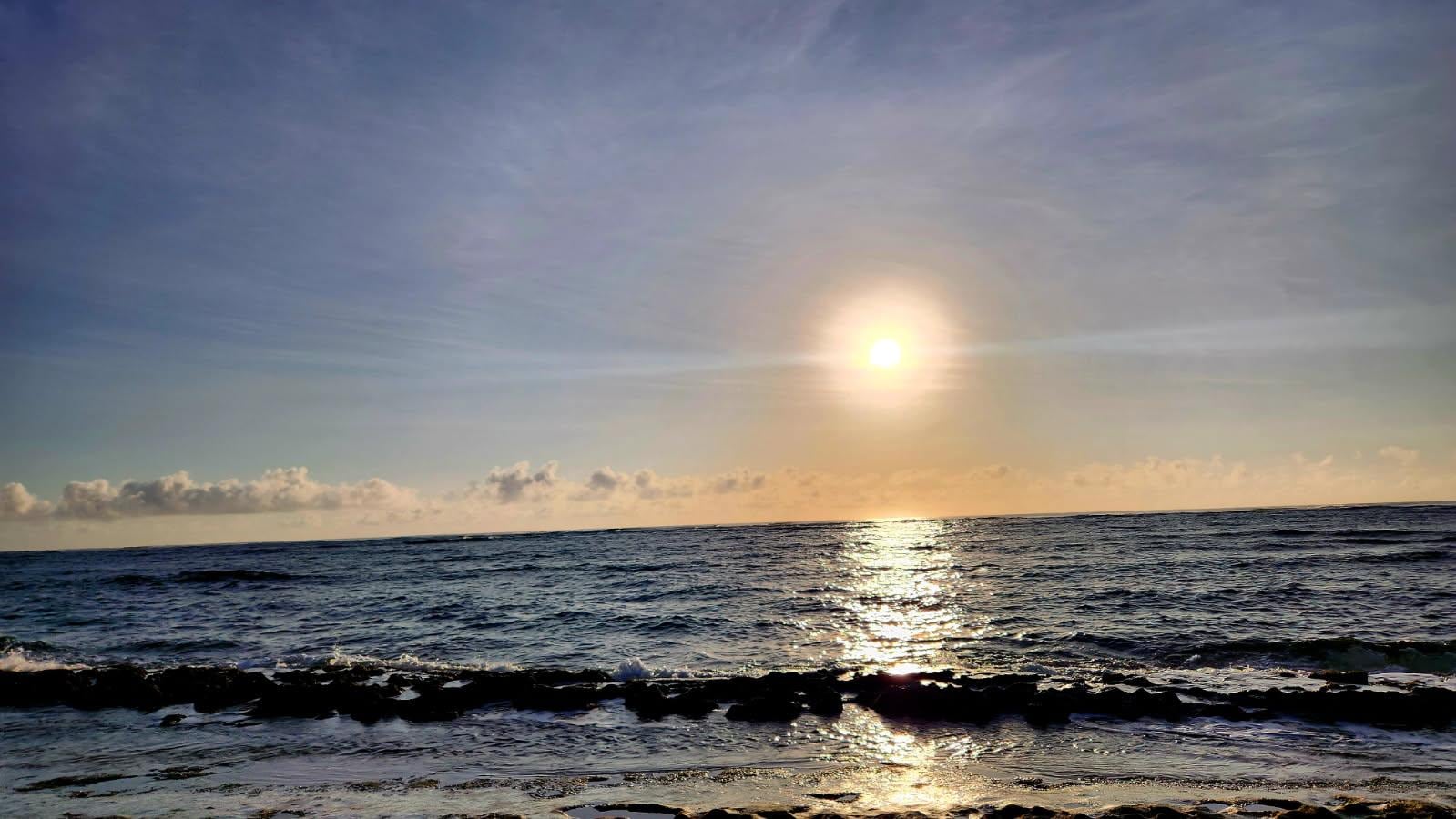 View of sunset from the beach in front of property