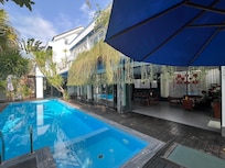 Chay Villas beautiful pool and our room up on the right.