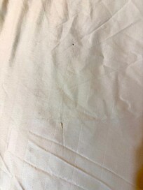 Bed sheets are worn with tear