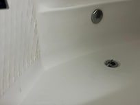 Bathtub did not drain and there was a thick layer of dirt all around it