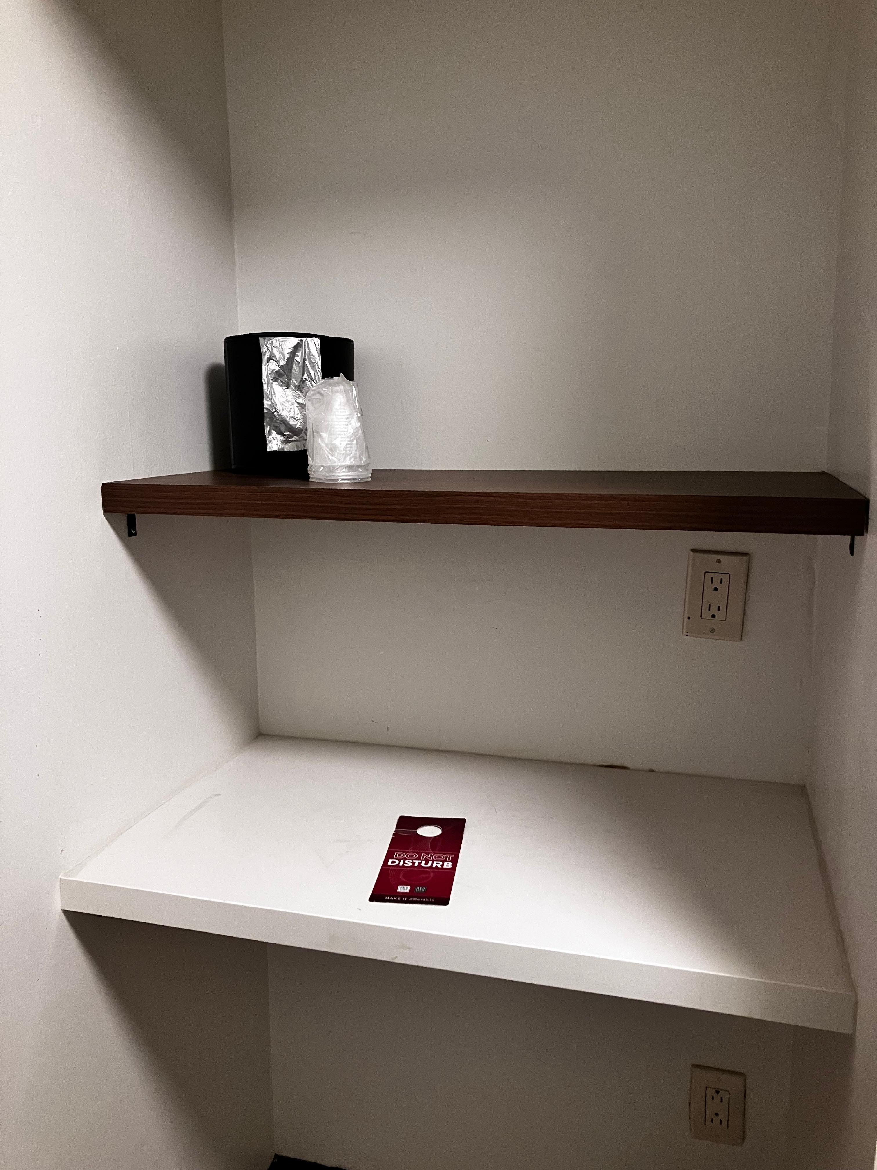 Ice bucket on shelf next to door.  There should also be a coffee maker in this area.