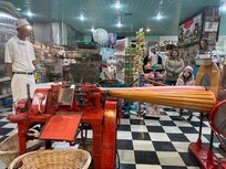 Old Smoky Candy Kitchen is a must see and taste. This machine is 101 years old. The candy is so good!