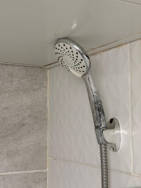 The shower head was very old and dirty.