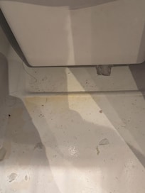dirty fridge with human hair