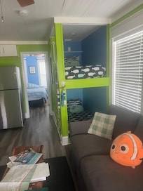 Living space with cute bunk beds fit in