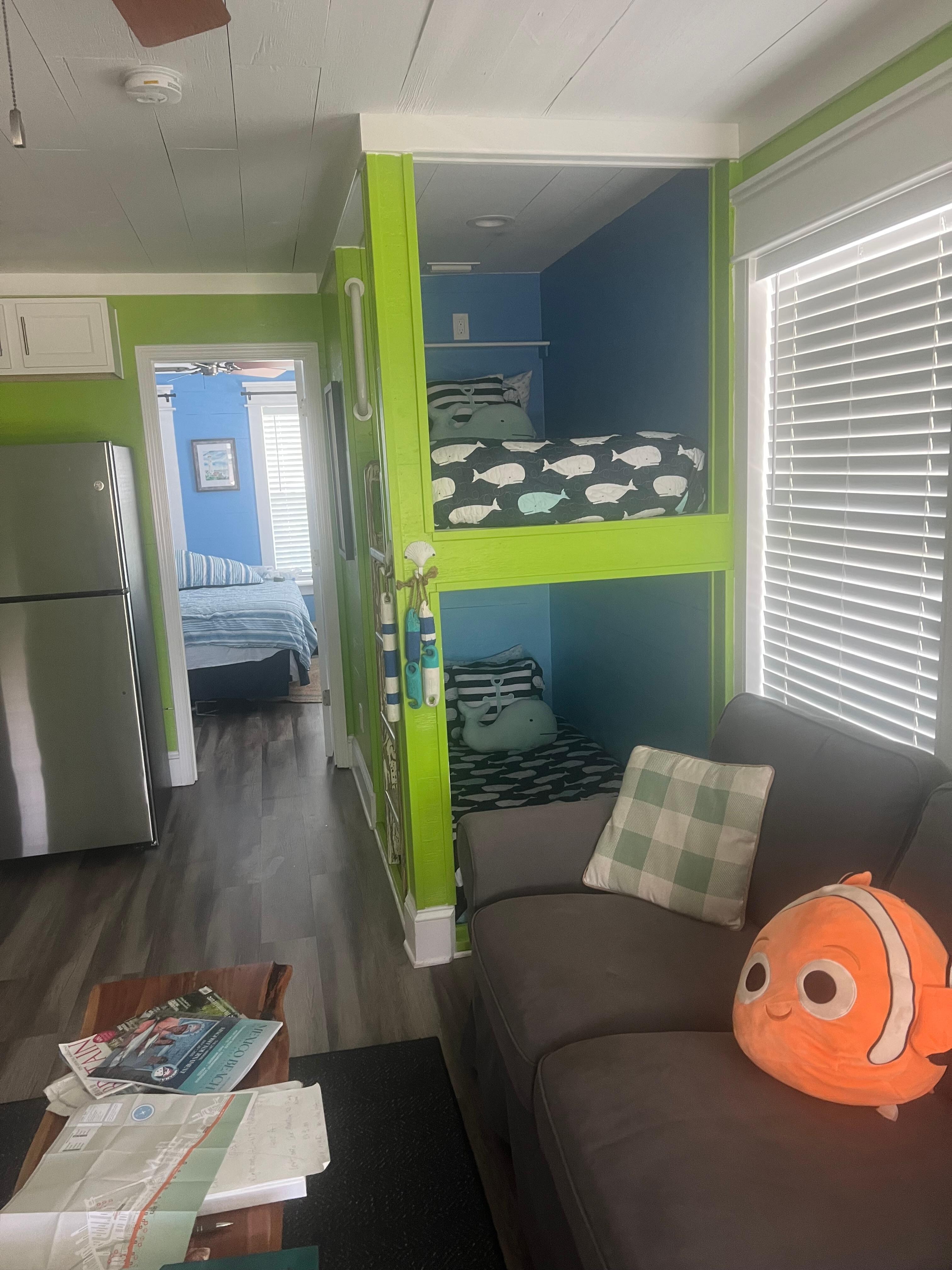 Living space with cute bunk beds fit in