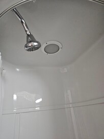 Interesting shower head placement. But since there's no light working in the shower, facing out made scene.