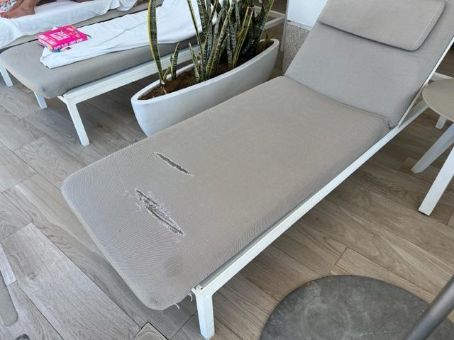 This was the lounger when we came to our cabana.  Torn up and not covered with a lounge cover. No towels.  No water. Stood around waiting  to be recognized that we were there.