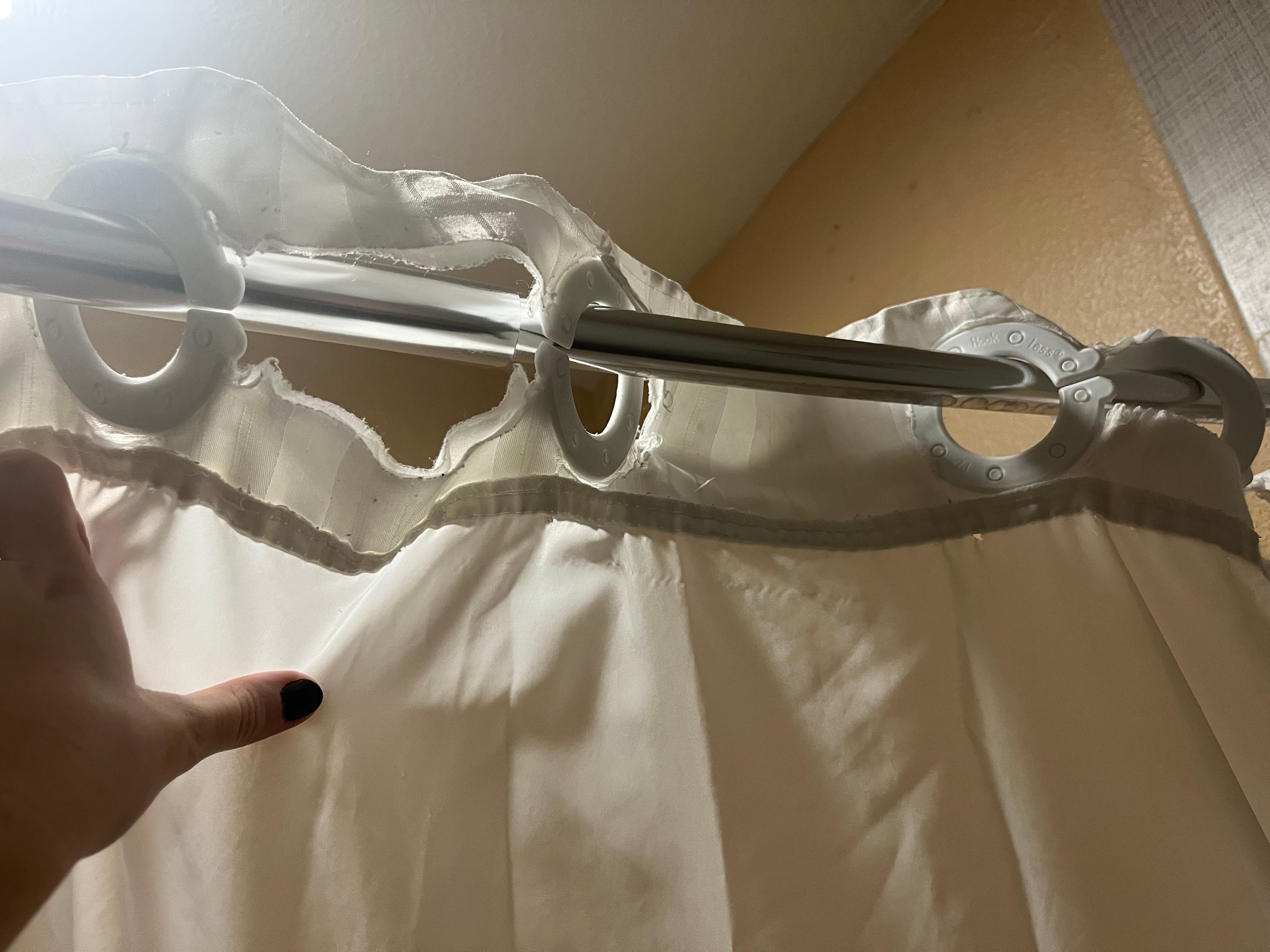 Ripped shower curtain