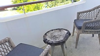Outdated furniture on the small balcony