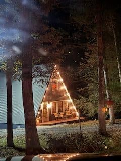 Nighttime photo of the front of the home - LOVE the lights