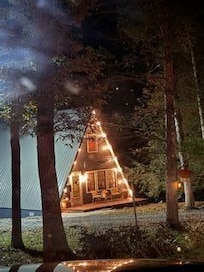 Nighttime photo of the front of the home - LOVE the lights