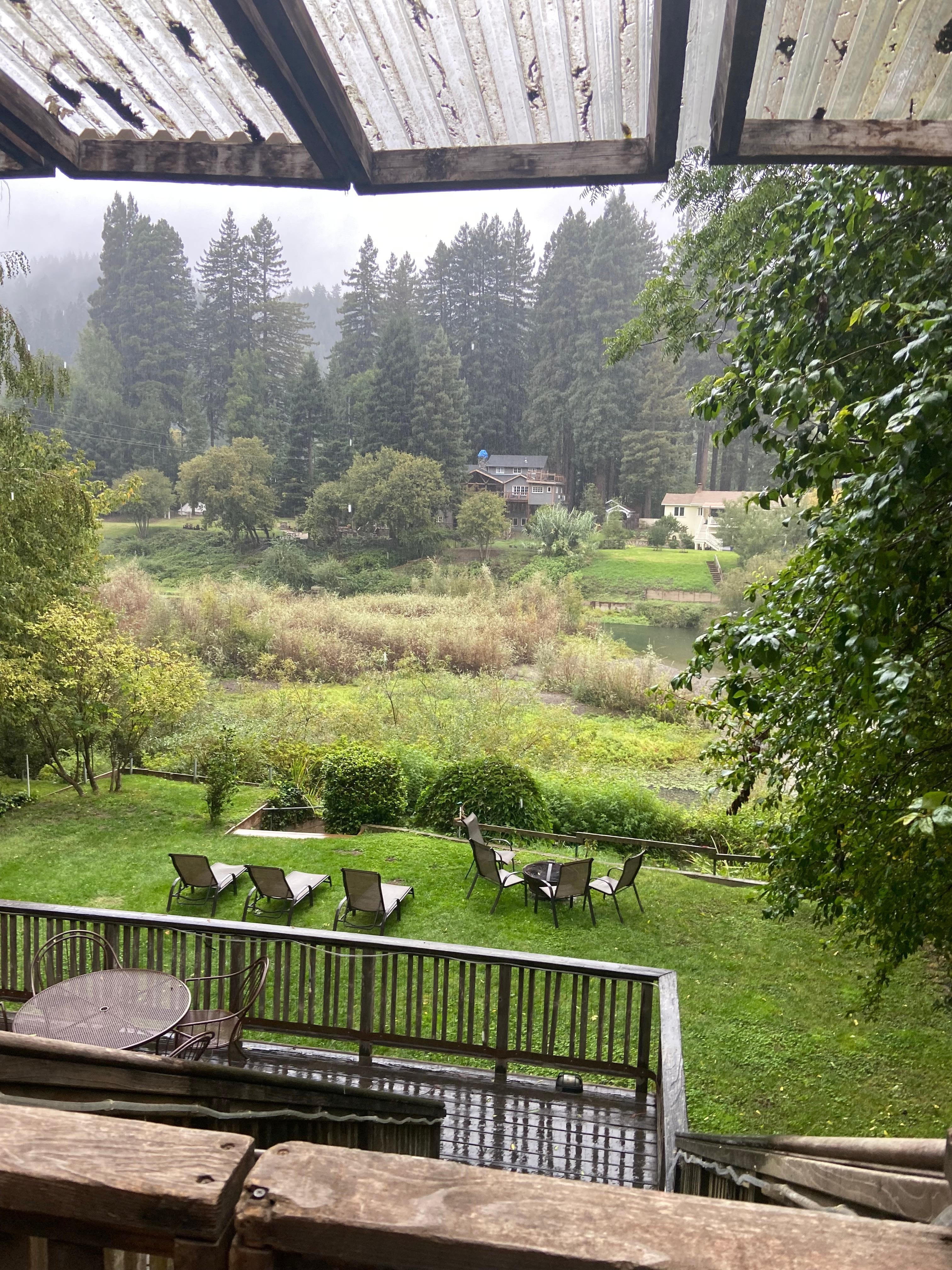  View from upper covered porch with plenty of seating and a picnic table for outdoor dining 
