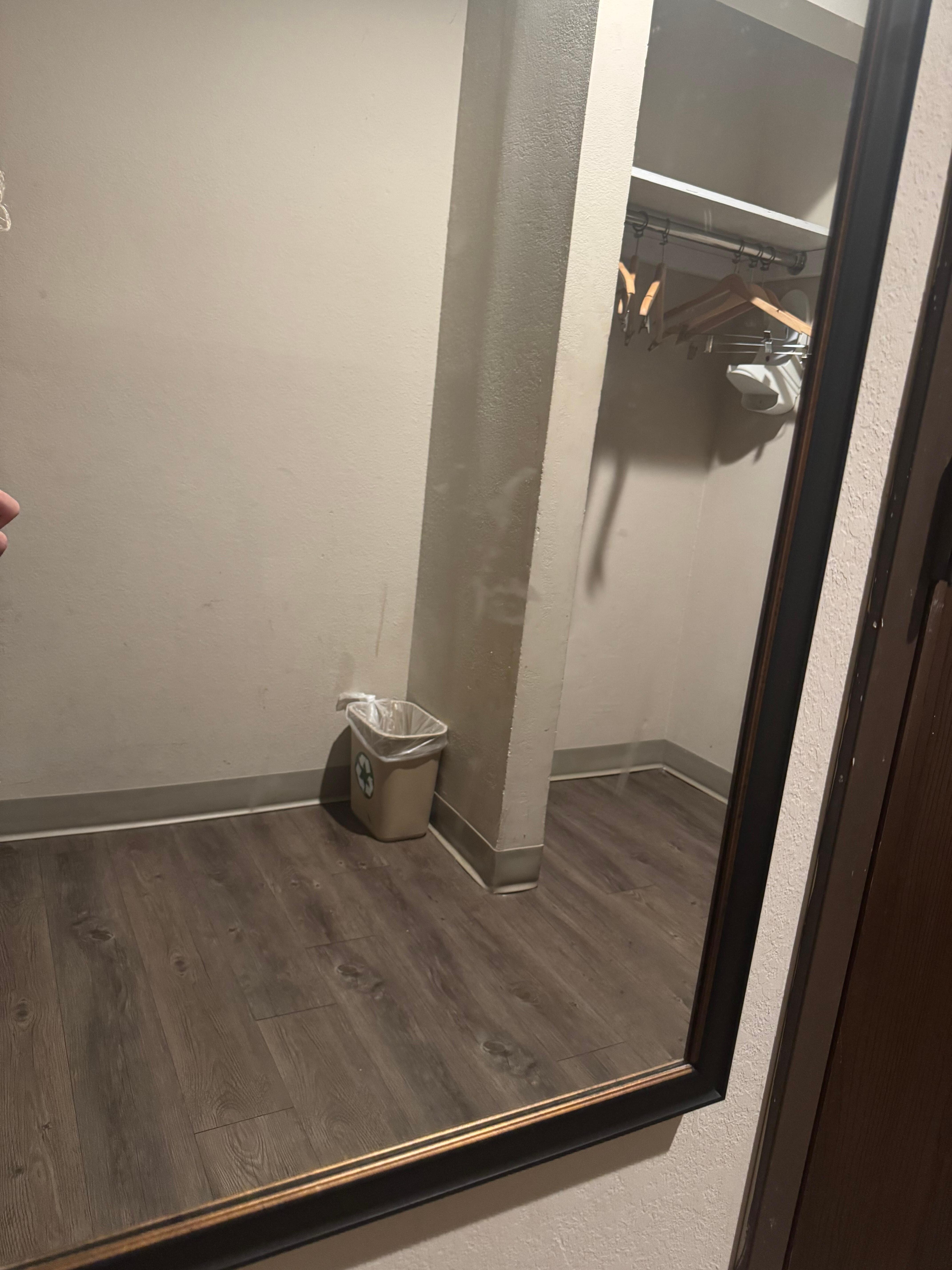 Kiss marks and hand prints on mirror