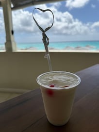 View of the beach while sitting in the restaurant drinking a piña colada
