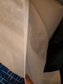 This was the thickness of the bed covering. It was also stained. There was 1 thermal blanket for 2 beds