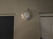 The walls had holes and there was one patch by the bathroom. I opened the door and flipped on the light switch, nothing happened. I had to use my phone's light to get to the other side and turn on the bathroom light.