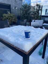 Our first snow experience, and the rooftop was a great way to see the white city.