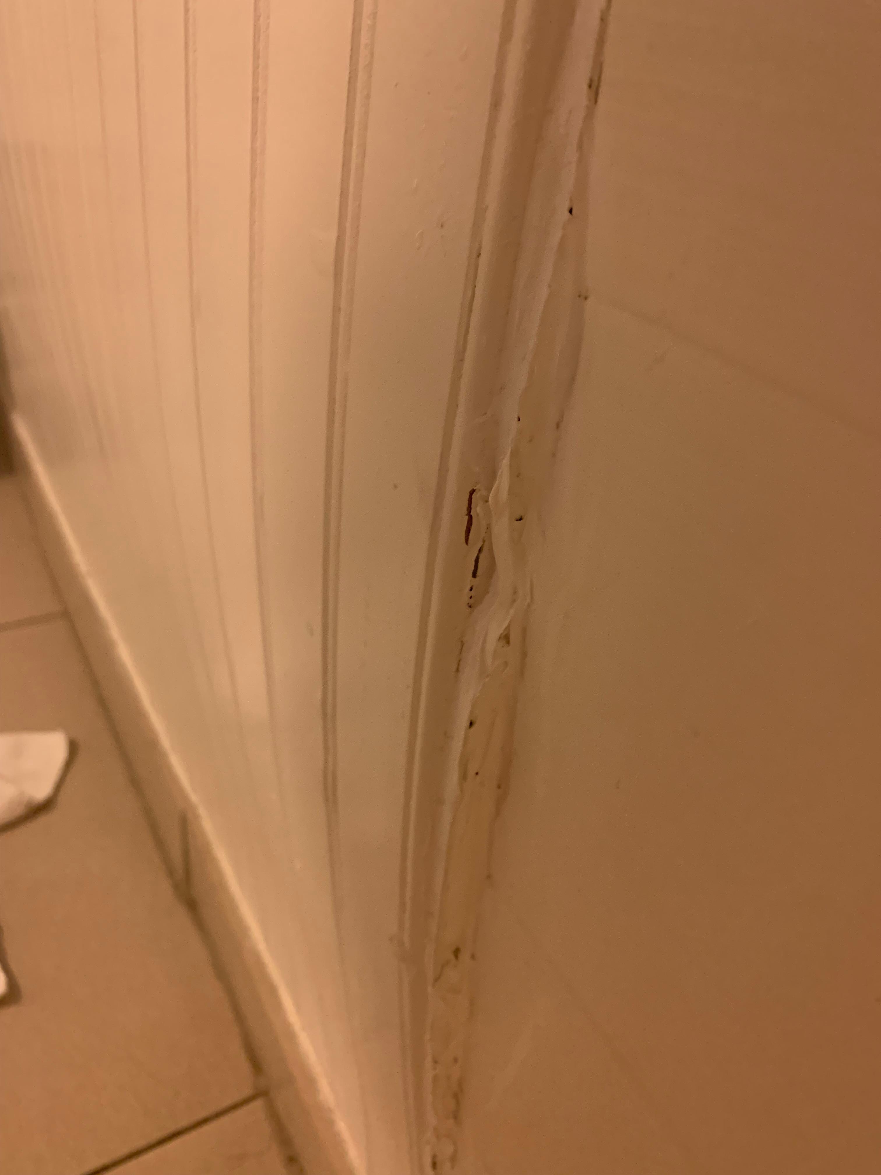 instead of making the wall level and striaght, they just added a ton of caulking to make it fit. You can see there is a large bow in the wall.