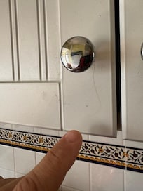 Hair wrapped around kitchen cabinet pull.
So gross!