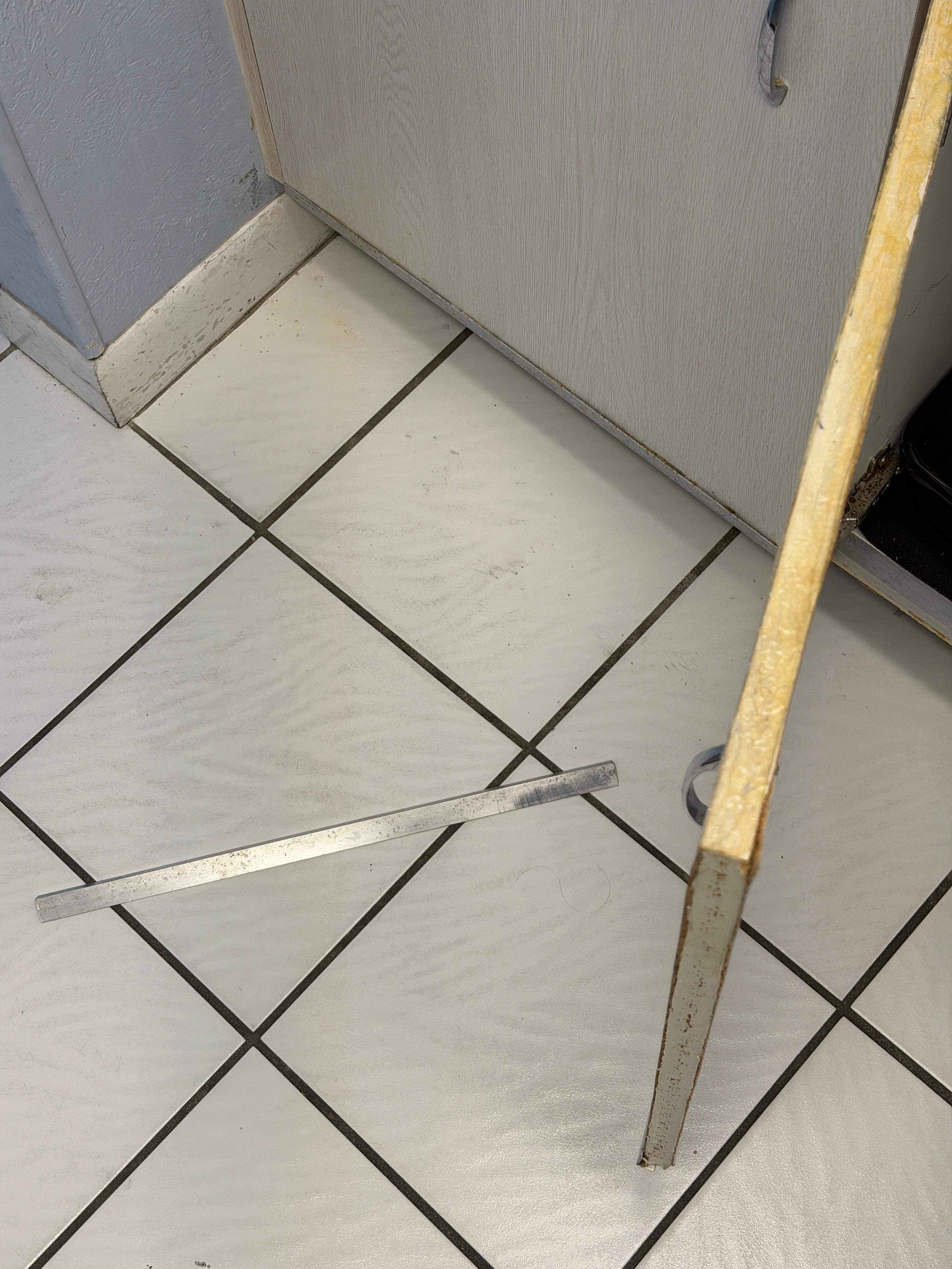Metal trim popped off when opening cabinet 