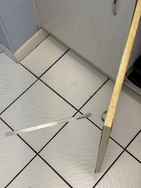 Metal trim popped off when opening cabinet