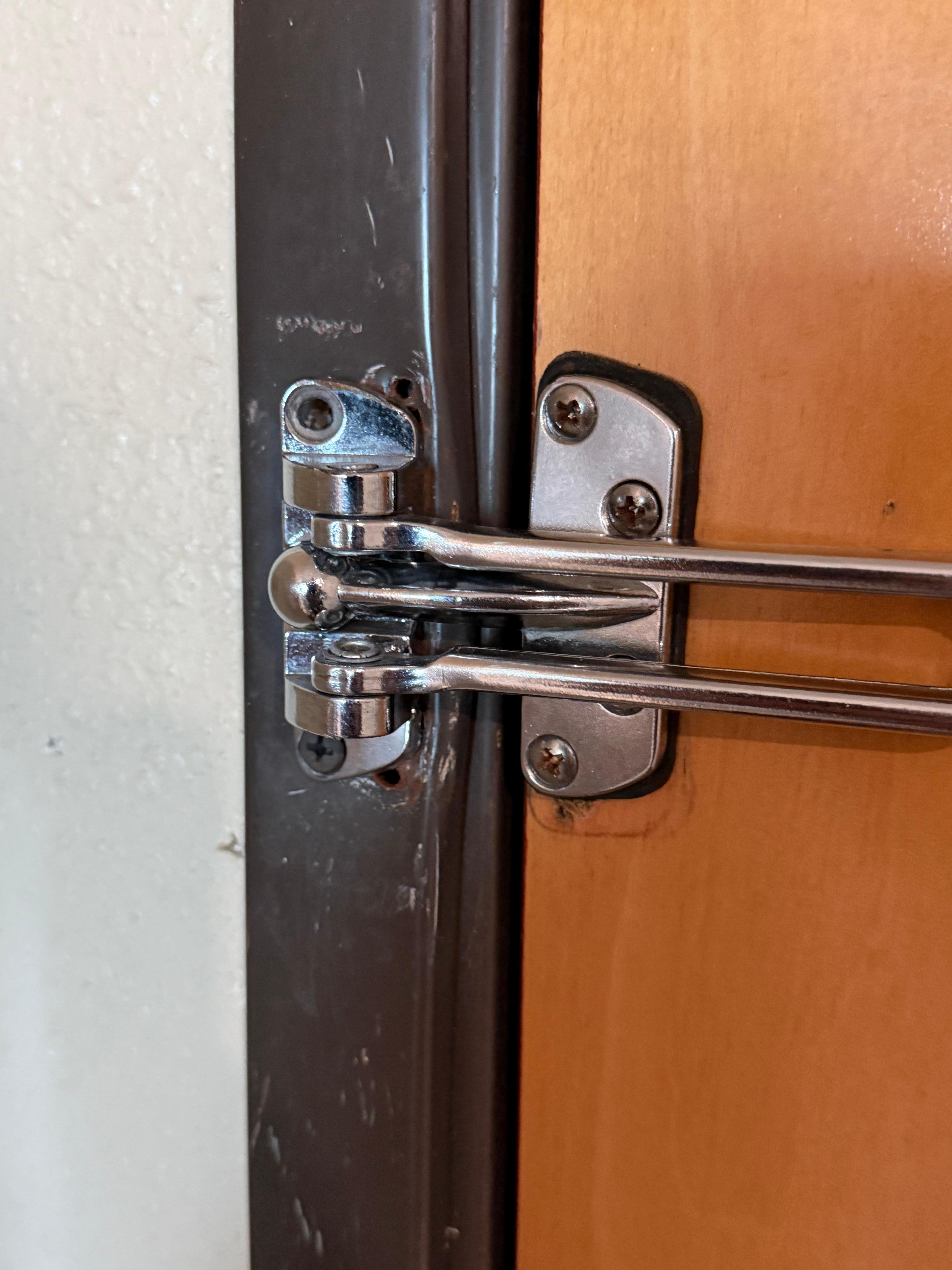 Damaged/unsecured lock in room. 