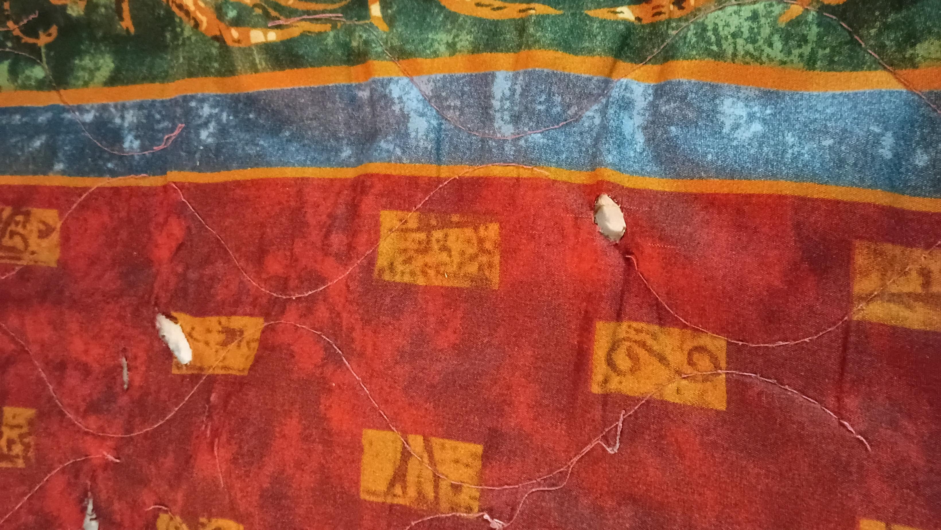 More cigarette burns in comforter 