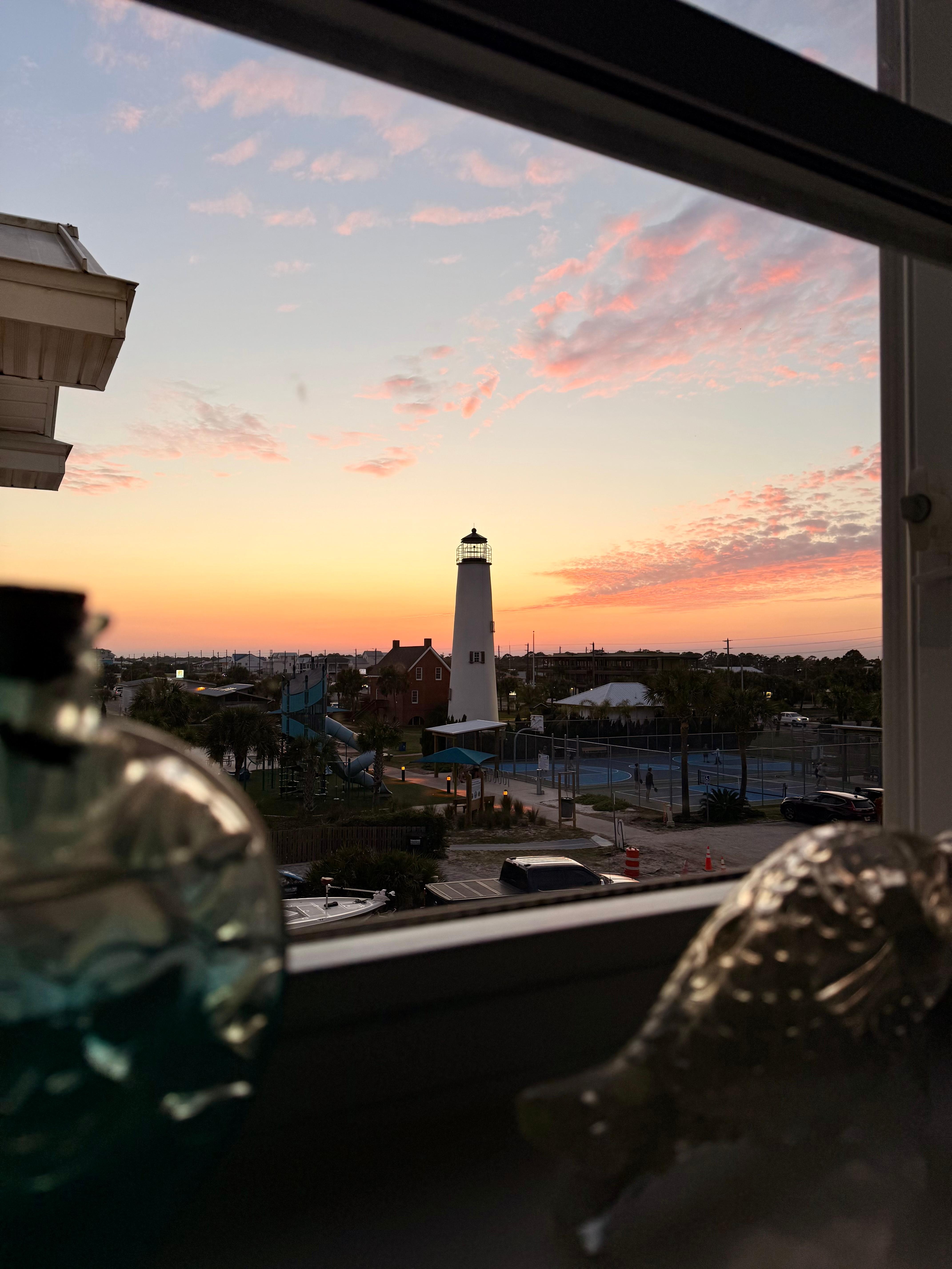 View of sunset behind lighthouse and park from kitchen window