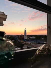 View of sunset behind lighthouse and park from kitchen window