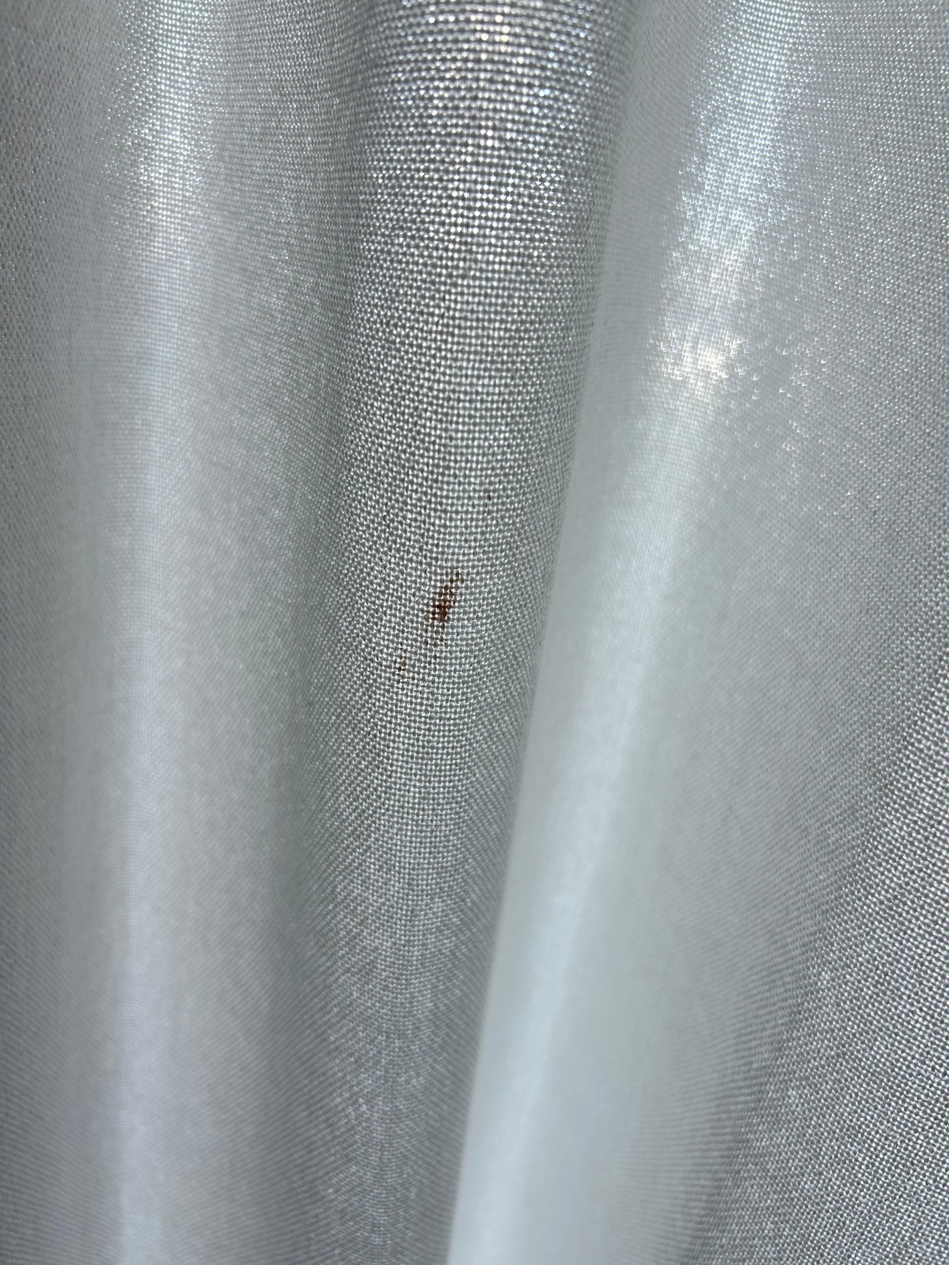 Looks to be blood on sliding glass door curtain. 