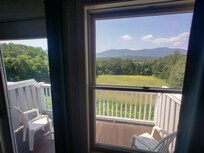 View through back door and windows, Aug 2025.