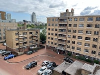 The view of neighbouring flats from Mikeâs balcony.