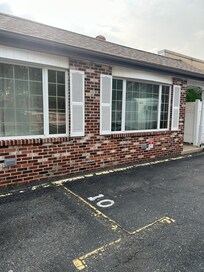 Exterior looks out over a dirty parking lot