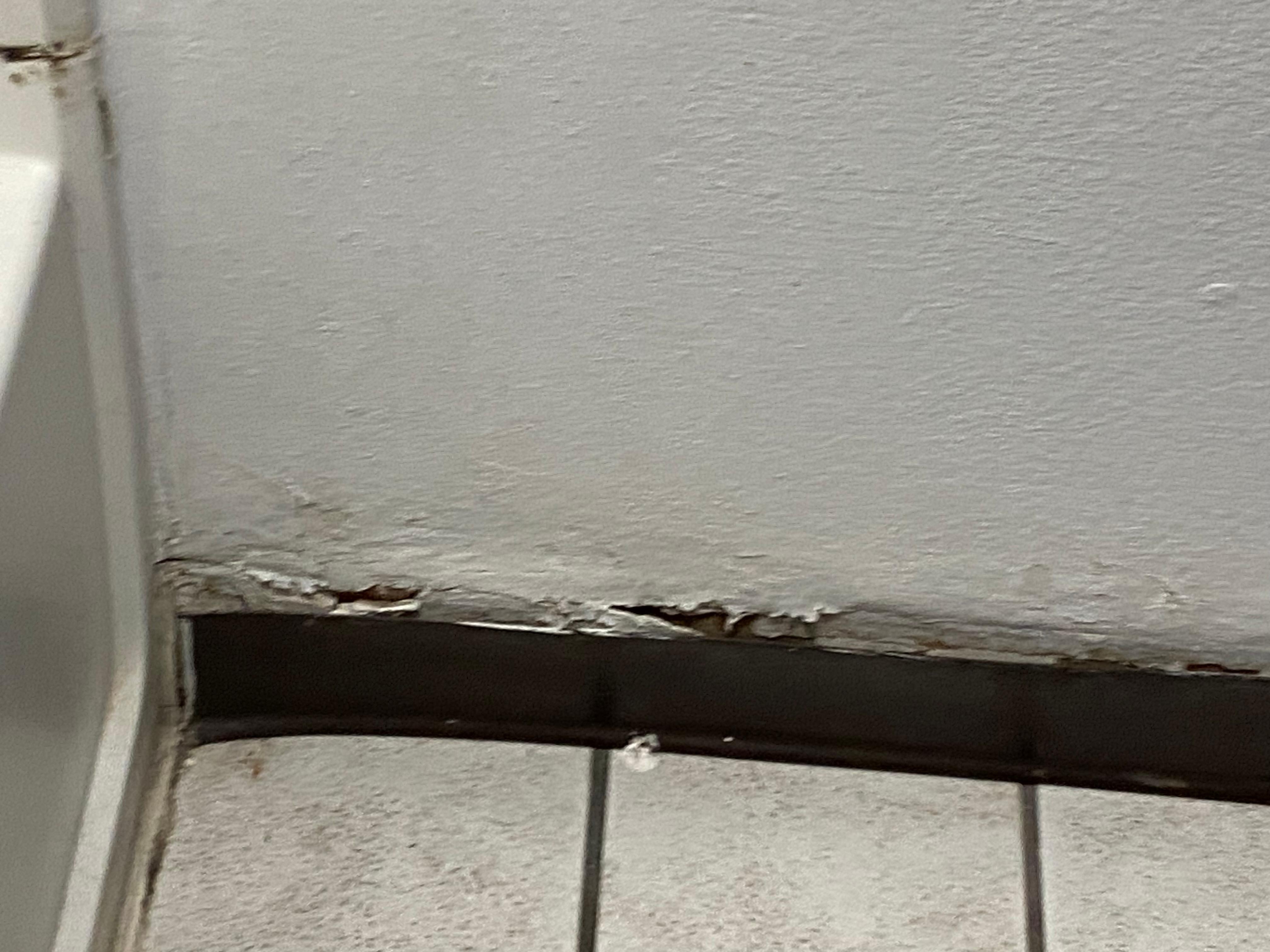 Restroom floor base was falling off.