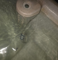 Beer can in the hot tub.