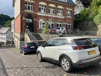Parking in front of the hotel.