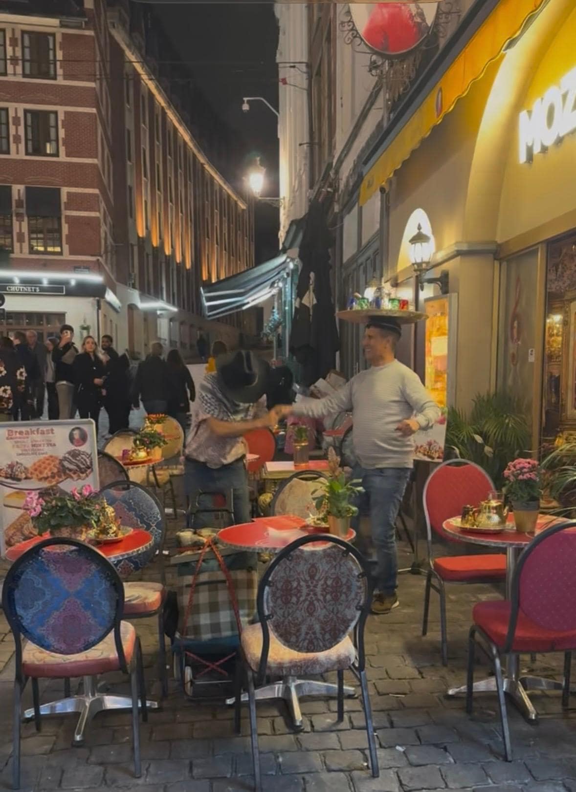 Right outside of Mozart Hotel at night (owner of hotel having a bit of fun)