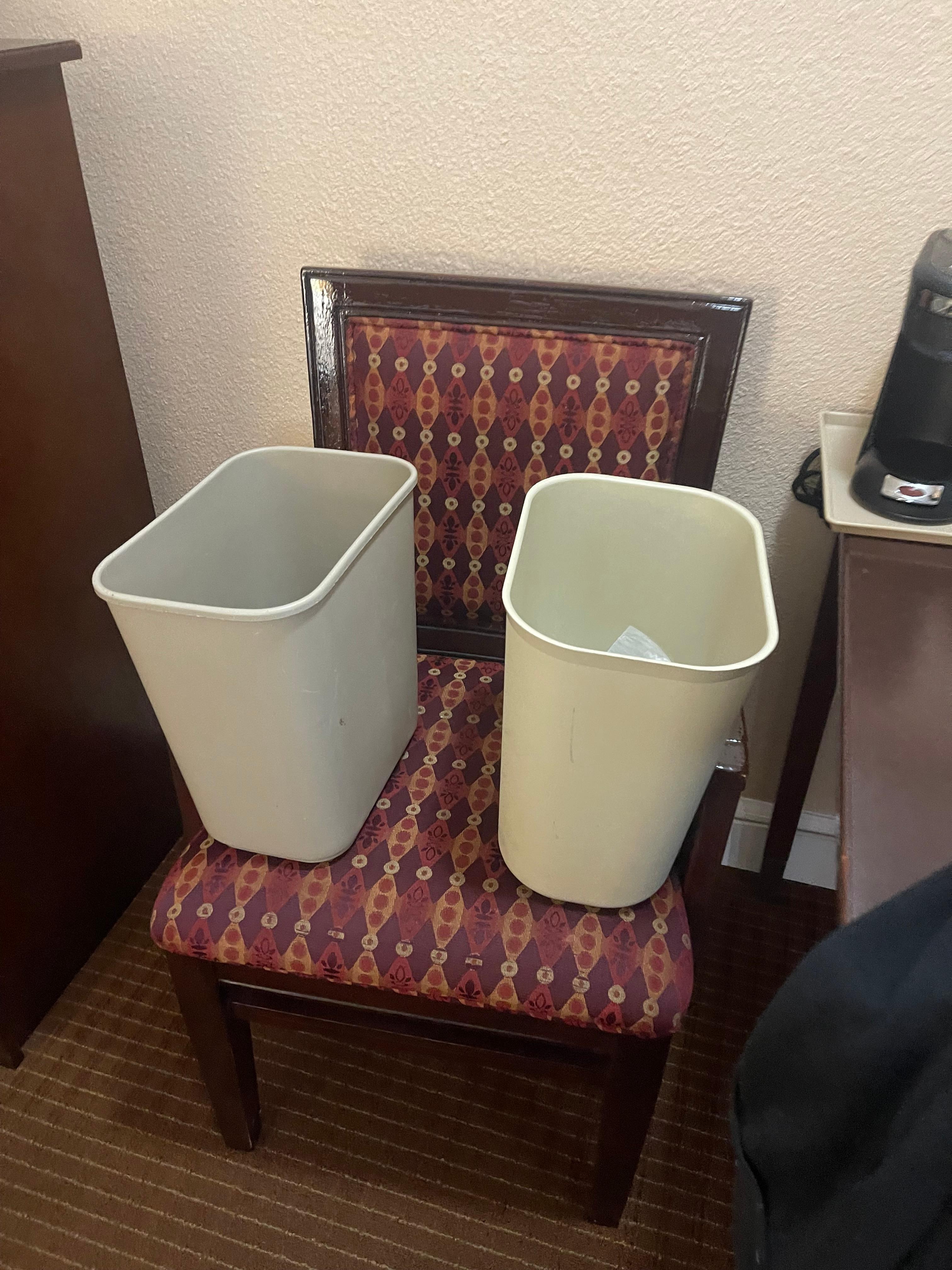Cleaner left the trash cans on this chair with plastic liners